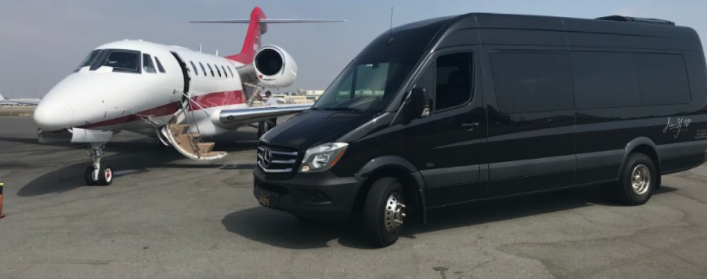 Image of Limo SF VIP’s Mercedes Executive Sprinter Van beside a private jet.