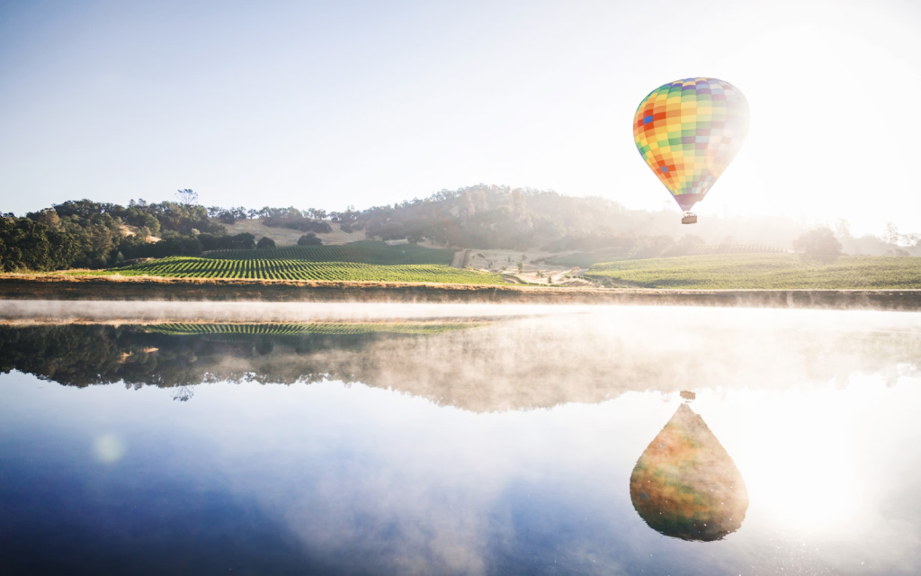 View of a hot air balloon over Napa Valley.