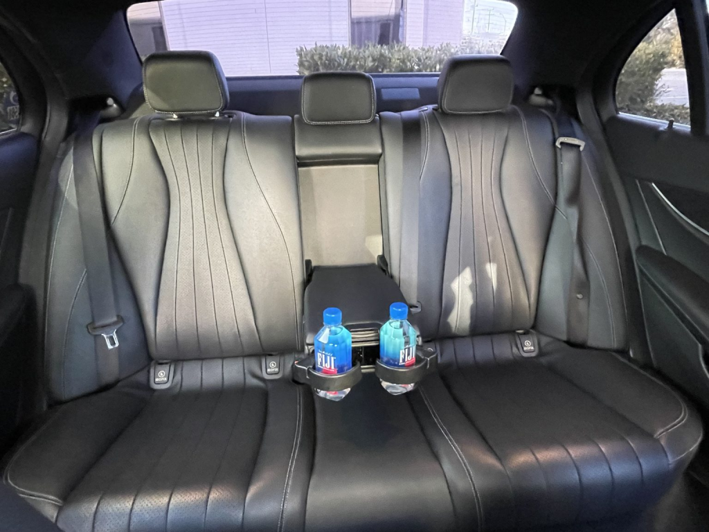 The interior of the Mercedes-Benz E300 with bottled water.