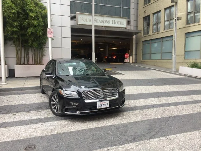 Black Lincoln Continental sedan outside the Four Seasons Hotel San Francisco