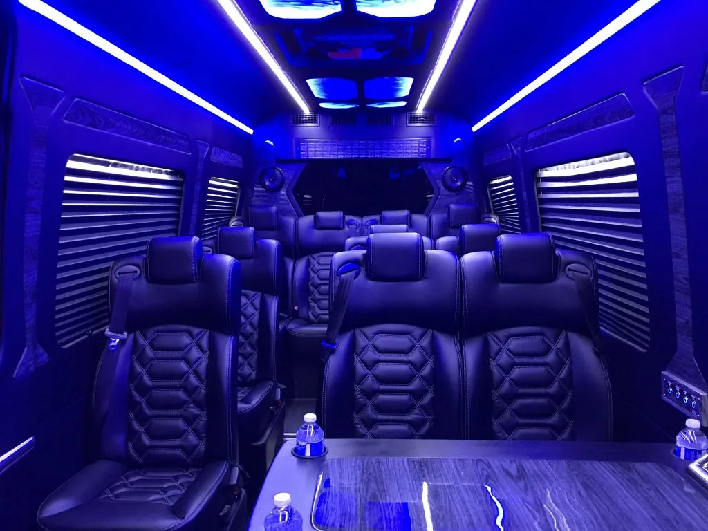 Sprinter limo van interior with leather seats and blue LED lighting