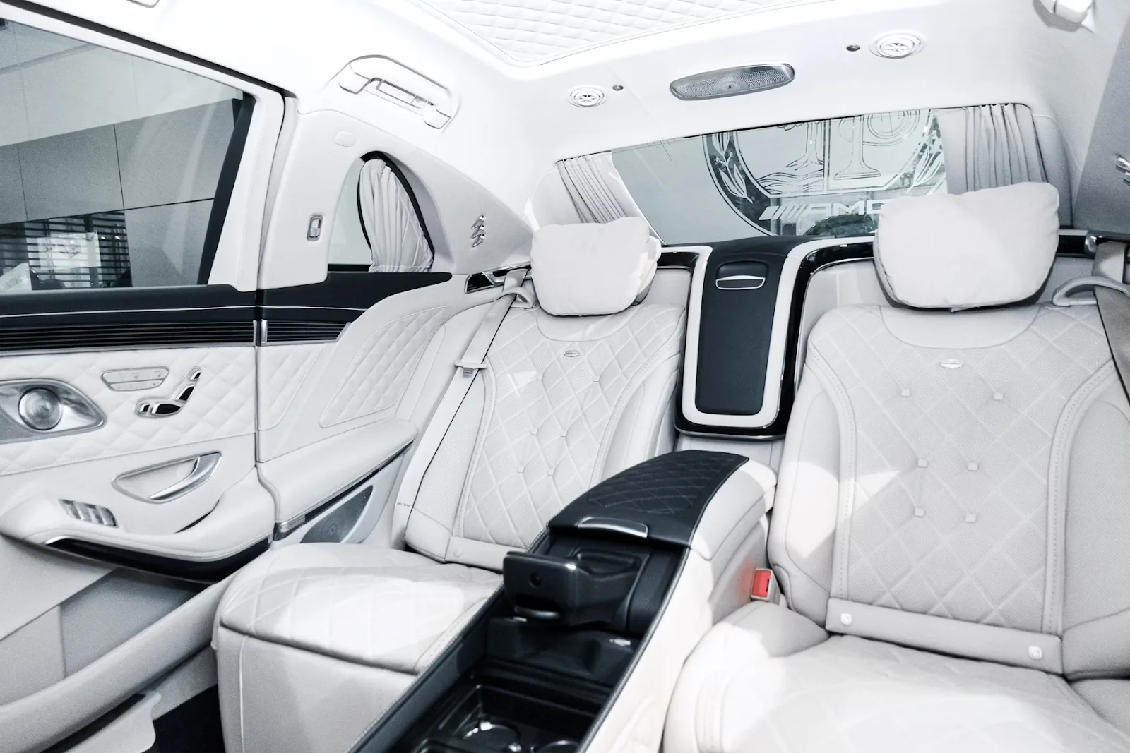 Sedan rear cabin with white quilted leather seats