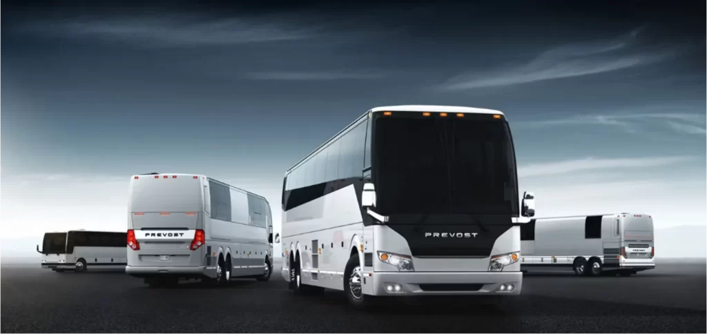 Fleet of white Prevost motorcoaches lined up