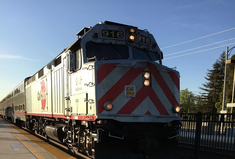 Caltrain locomotive at a station platform on a sunny day