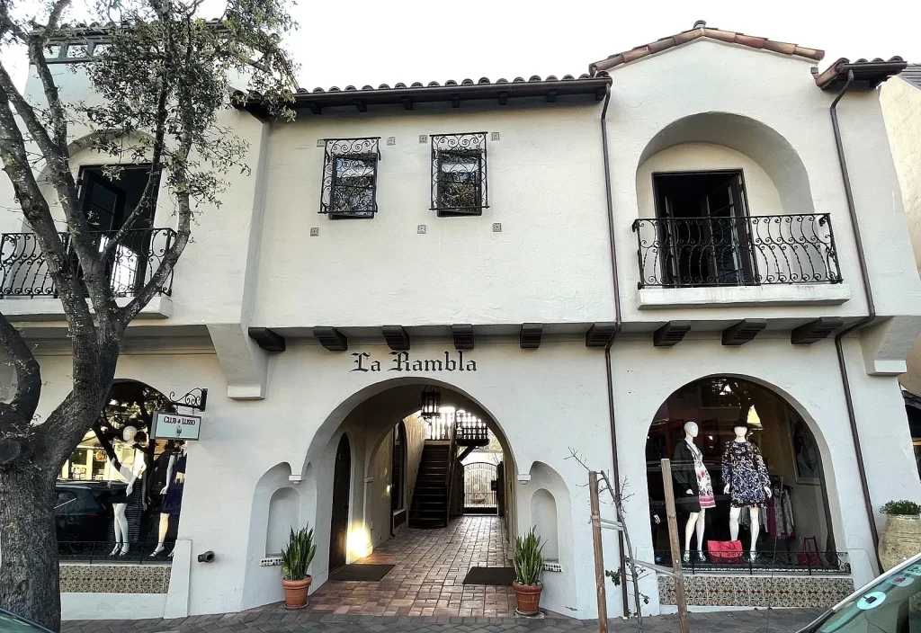 Spanish-style La Rambla building with arched shopfronts in Carmel-by-the-Sea