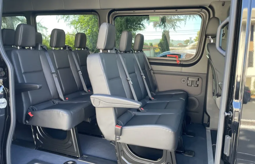Mercedes Sprinter van interior with gray seats and large side windows