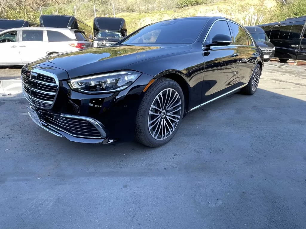 Black Mercedes-Benz S-Class sedan parked in a lot